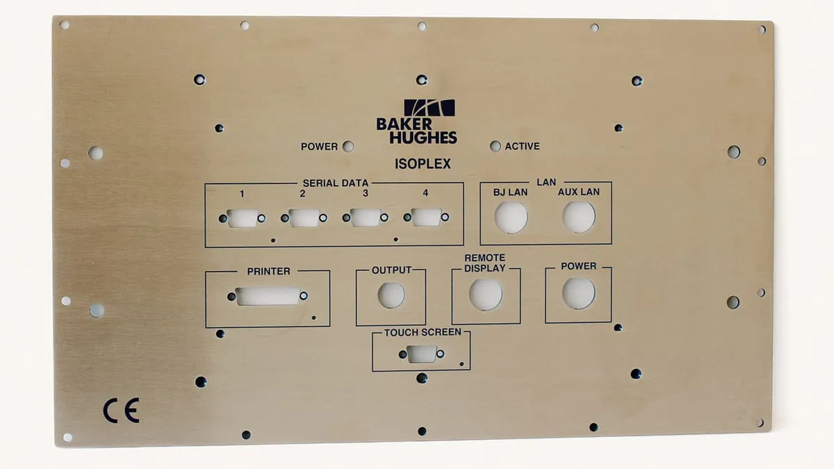 A Baker Hughes Isoplex instrument panel plate with display, printer, and connector cutouts
